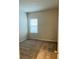 Bedroom featuring neutral walls, plush carpet, and one bright window at 29307 Meadowcroft Ave, Wesley Chapel, FL 33544