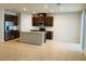 Modern kitchen with stainless appliances and island at 29307 Meadowcroft Ave, Wesley Chapel, FL 33544