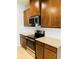 Modern kitchen with stainless steel range and granite countertops at 29307 Meadowcroft Ave, Wesley Chapel, FL 33544