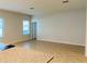 Open-concept living room with tiled floors and natural light at 29307 Meadowcroft Ave, Wesley Chapel, FL 33544