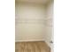 Empty walk-in closet featuring metal shelving and carpet floors at 29307 Meadowcroft Ave, Wesley Chapel, FL 33544