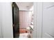 Bathroom featuring a tub with a shower, floral shower curtain, and updated fixtures at 4217 Avanti Cir, New Port Richey, FL 34655