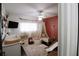 Cozy bedroom featuring pink accent wall, play area, canopy bed and lots of natural light at 4217 Avanti Cir, New Port Richey, FL 34655