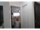 Hallway view leading to a bedroom, showcasing the home's layout and design at 4217 Avanti Cir, New Port Richey, FL 34655