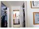 The hallway features two closets and a bathroom with a well lit vanity and modern finishes at 4217 Avanti Cir, New Port Richey, FL 34655