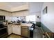 Updated kitchen features stainless appliances, butcher block counters and dining area at 4217 Avanti Cir, New Port Richey, FL 34655