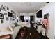 Bright living room featuring a large sectional couch, dark floors, and sliding barn door at 4217 Avanti Cir, New Port Richey, FL 34655