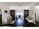 Cozy living room with modern barn doors, hardwood floors and ample seating at 4217 Avanti Cir, New Port Richey, FL 34655