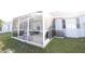Enclosed patio offering a bug-free space to enjoy the backyard at 4217 Avanti Cir, New Port Richey, FL 34655