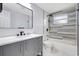 Modern bathroom featuring updated vanity, fixtures, and tiled shower-tub combo at 1024 Applewood Dr, Clearwater, FL 33759