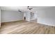 Spacious living room with light wood flooring, ceiling fans, and neutral paint at 1024 Applewood Dr, Clearwater, FL 33759