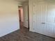 Bedroom featuring a closet and doorway leading into another room at 25126 Calusa Dr, Punta Gorda, FL 33955