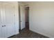 Bright bedroom featuring closet and doorway leading into another room at 25126 Calusa Dr, Punta Gorda, FL 33955