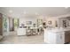 Open concept living space featuring a large island, dining area, and living room at 25126 Calusa Dr, Punta Gorda, FL 33955