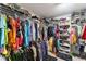 Walk-in closet with custom shelving and racks at 3035 Countryside Blvd # 15B, Clearwater, FL 33761