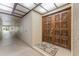 Inviting entryway featuring a decorative front door, neutral walls, and a hallway, showcasing a warm welcome at 3035 Countryside Blvd # 15B, Clearwater, FL 33761