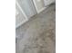 Bedroom featuring neutral carpet, white trim, and a door at 8306 N Orleans Ave, Tampa, FL 33604