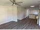 Open concept living area with new floors, recessed lighting, and adjacent eat-in kitchen at 8306 N Orleans Ave, Tampa, FL 33604