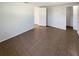 Neutral bedroom with tile flooring and views to additional rooms at 9210 Crabtree Ln, Port Richey, FL 34668