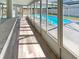 Enclosed lanai with views of the swimming pool, offering a screened area at 9210 Crabtree Ln, Port Richey, FL 34668