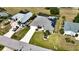 Aerial view of a well-manicured home with solar panels and a long driveway surrounded by lush landscaping at 2248 Bonn Ct, Punta Gorda, FL 33983