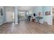 Bright living room with stylish floors, a large window, a light blue wall, and plenty of space at 2248 Bonn Ct, Punta Gorda, FL 33983