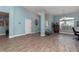 Bright living room featuring blue walls, stylish floors, and a large window with lots of natural light at 2248 Bonn Ct, Punta Gorda, FL 33983