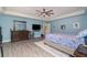 Spacious main bedroom with wood-look floors and ensuite bath at 2248 Bonn Ct, Punta Gorda, FL 33983