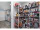 Walk-in pantry featuring ample shelving for storage of food and kitchen items at 2248 Bonn Ct, Punta Gorda, FL 33983
