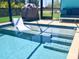 Enjoy the sun shelf and steps into this inviting pool at 2248 Bonn Ct, Punta Gorda, FL 33983