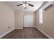 Bedroom with wood-look floors, ceiling fan, mini-split AC, and closet at 4621 25Th S Ave, St Petersburg, FL 33711