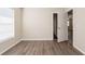 Bright bedroom with wood-look flooring, window, and doorway to another room at 4621 25Th S Ave, St Petersburg, FL 33711