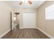 Open bedroom with wood-look flooring, closet and view of other rooms at 4621 25Th S Ave, St Petersburg, FL 33711