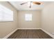 A sunlit bedroom featuring modern ceiling fan and sleek, wood-look laminate flooring at 4621 25Th S Ave, St Petersburg, FL 33711