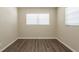 Neat bedroom with neutral walls, new flooring, and bright windows allowing for ample light at 4621 25Th S Ave, St Petersburg, FL 33711