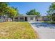 Lovely single-Gathering home featuring a manicured lawn, freshly painted siding, and a concrete driveway at 4621 25Th S Ave, St Petersburg, FL 33711
