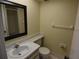 Bathroom with a white vanity, toilet, and shower with glass doors at 4826 Marine Pkwy # 202, New Port Richey, FL 34652