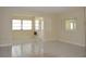 Open living room with tile flooring and natural light at 4826 Marine Pkwy # 202, New Port Richey, FL 34652