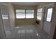 Bright room with tile floors and multiple windows at 4826 Marine Pkwy # 202, New Port Richey, FL 34652