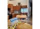 Well equipped kitchen with stainless steel appliances and wood cabinetry at 4666 Clarke St, North Port, FL 34286