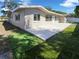 A beautifully landscaped backyard with an expansive concrete patio at 10454 138Th St, Largo, FL 33774