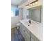 Bright bathroom featuring shiplap accents, a white vanity, and updated fixtures at 10454 138Th St, Largo, FL 33774