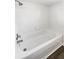 Bright bathroom with a white tiled shower-tub combo and modern shower head fixture at 10454 138Th St, Largo, FL 33774