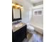Bathroom featuring granite vanity, a stylish mirror, and a shower-tub combination at 10454 138Th St, Largo, FL 33774