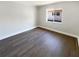 Cozy bedroom with modern flooring, fresh paint, and a bright window, perfect for relaxation at 10454 138Th St, Largo, FL 33774