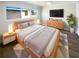 Modern bedroom with luxury vinyl flooring, a ceiling fan, and a large window at 10454 138Th St, Largo, FL 33774