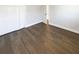 Bright bedroom featuring wood floors, double closets, and neutral paint at 10454 138Th St, Largo, FL 33774