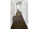 Hallway with dark hardwood floors and white trim at 10454 138Th St, Largo, FL 33774