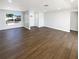 Spacious living room with natural light and wood flooring at 10454 138Th St, Largo, FL 33774