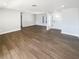 Spacious living room featuring new wood-look floors, neutral paint, and plenty of natural light at 10454 138Th St, Largo, FL 33774